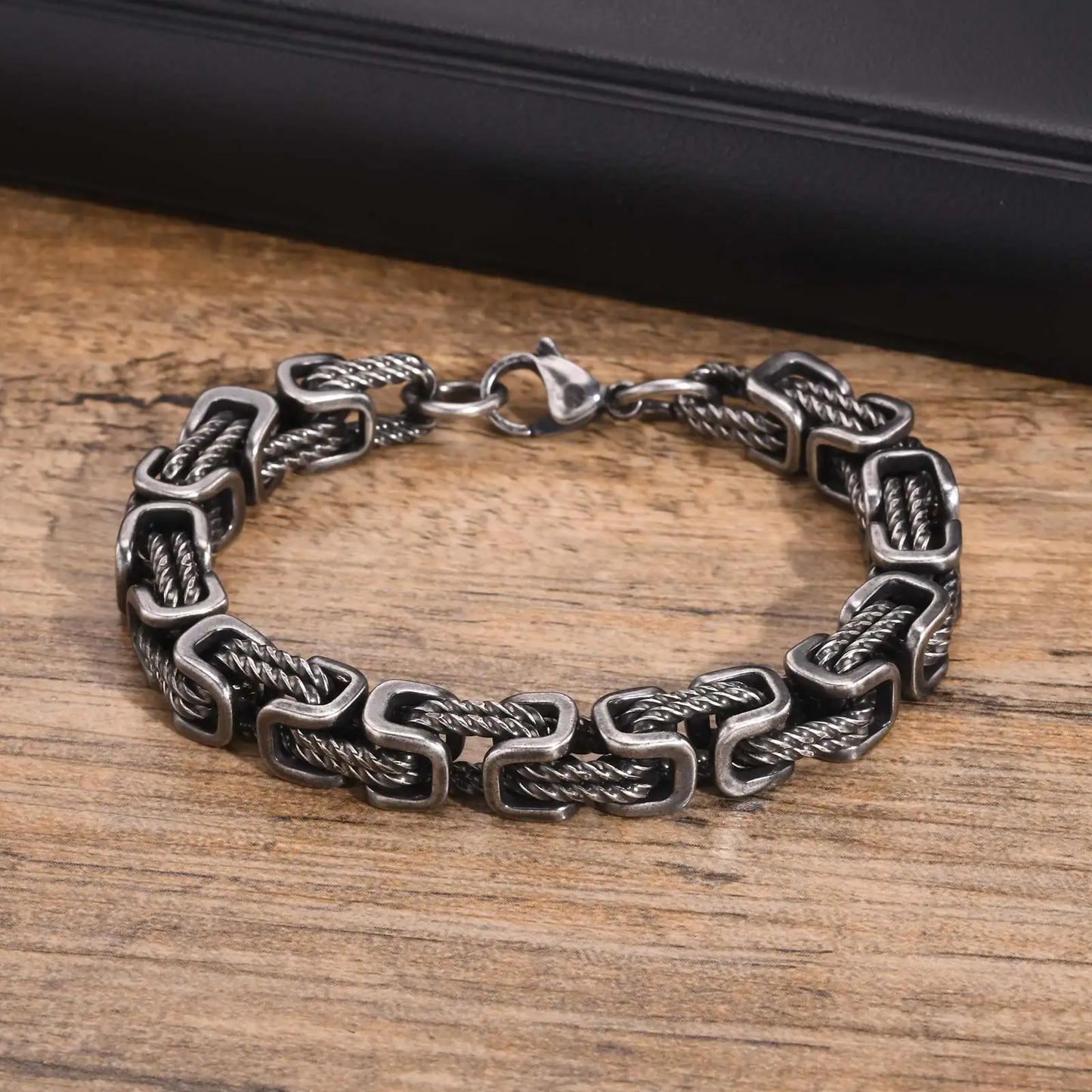 Stylish men's stainless steel chain bracelet, durable metal jewelry for a rugged look, polished.