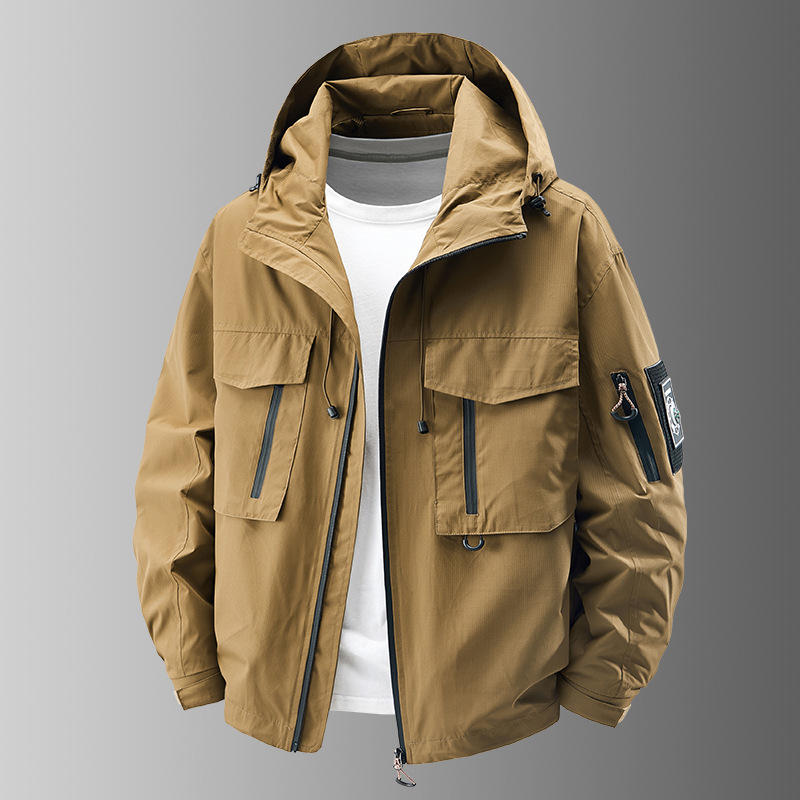 Multi-pocket men's utility jacket, durable tactical outerwear for all-weather adventure. Essential outdoor gear.