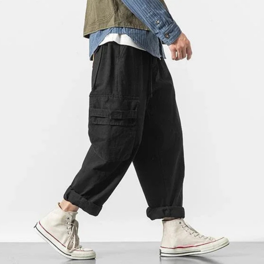 Men's baggy fit cargo pants, multi-pocket utility design, durable for streetwear looks.