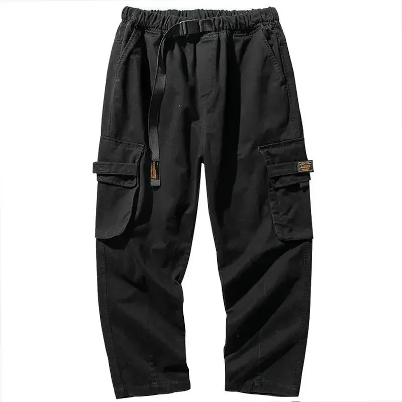 Versatile men's utility cargo pants, durable cotton blend, baggy fit, green color.