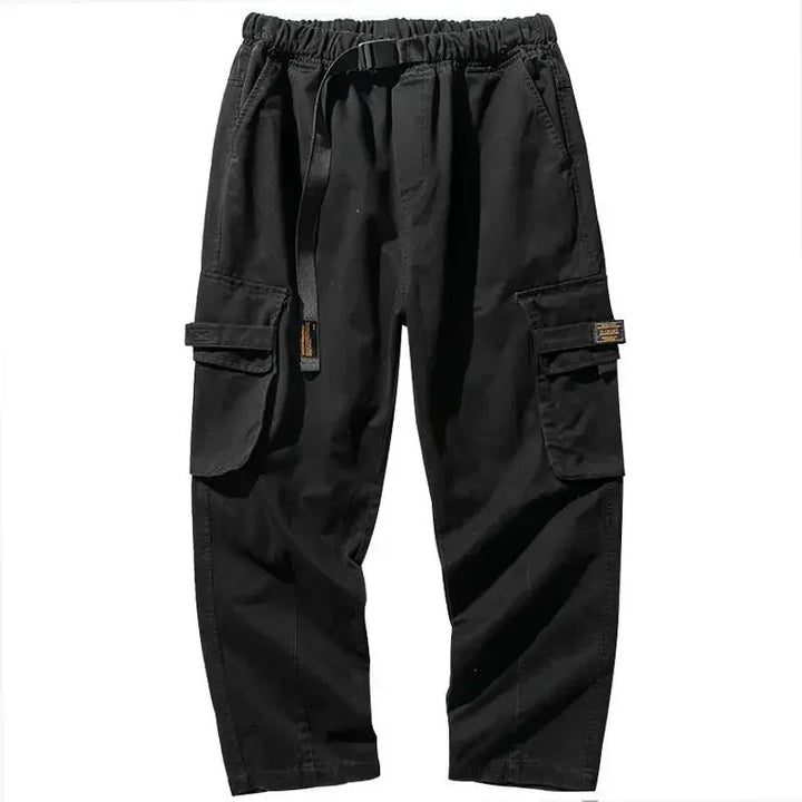 Versatile men's utility cargo pants, durable cotton blend, baggy fit, green color.