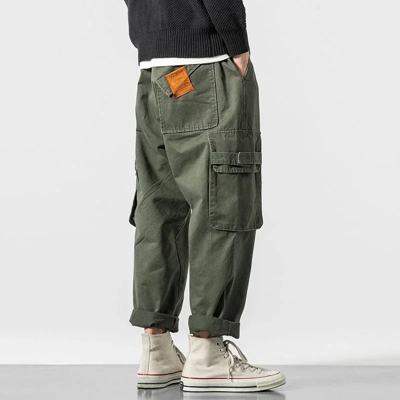Green men's durable cargo pants, baggy fit, streetwear style, cotton blend.