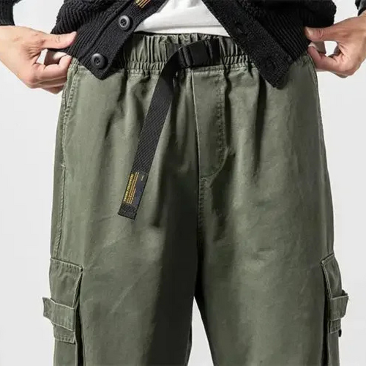 Baggy fit men's cargo pants, durable utility design, perfect for comfortable streetwear.