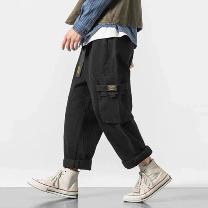 Streetwear men's cargo pants, baggy fit, durable cotton blend, green utility style.