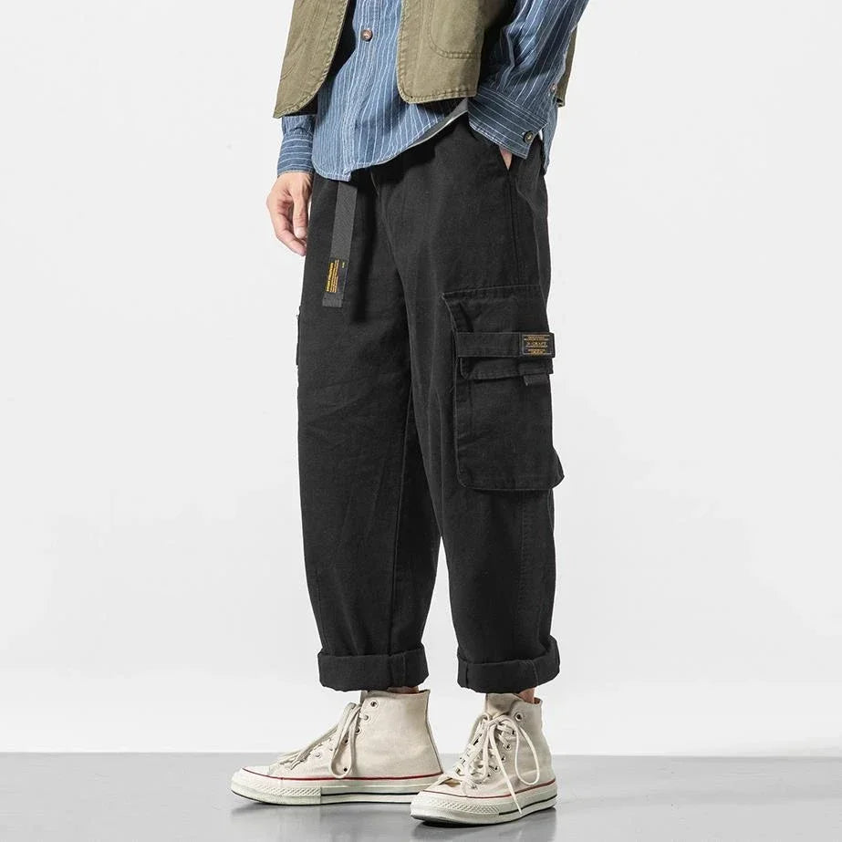 Green men's durable utility cargo pants, comfortable & stylish streetwear apparel.