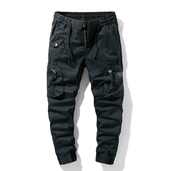 Khaki men's durable utility cargo pants with secure multi-pocket design, perfect for tactical & work use.