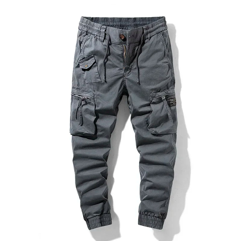 Black men's multi-pocket utility cargo pants, comfortable & durable for work, outdoor adventures, or casual wear.