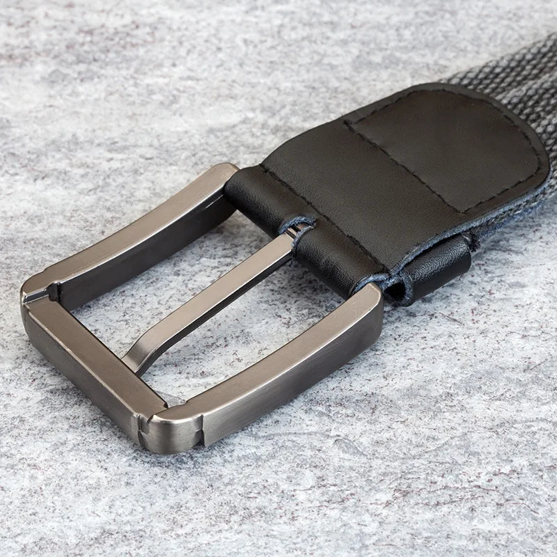 Essential men's accessory: durable woven belt with sophisticated leather accents, adjustable for comfort.