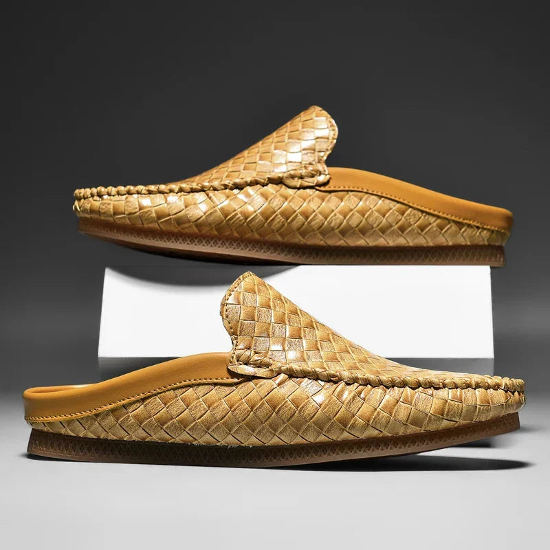 Stylish black men's slip-on loafers with a woven texture. Durabreeze comfort for versatile casual wear.