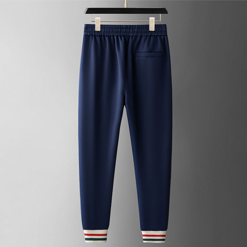 Men's casual outfit: Royal Navy full-zip tracksuit with legacy cream stripes. A comfortable two-piece set.