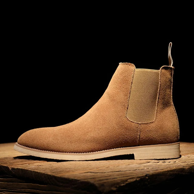Classic men's Chelsea boots, easy slip-on style. Comfortable, versatile footwear for casual wear and dress outfits.
