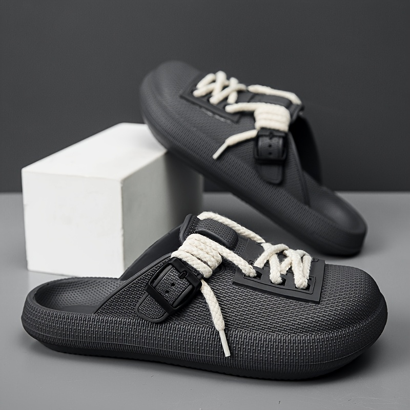 Man wearing Eclipse laced clogs, demonstrating casual style, everyday comfort, and adjustable fit.