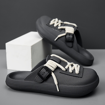 Man wearing Eclipse laced clogs, demonstrating casual style, everyday comfort, and adjustable fit.