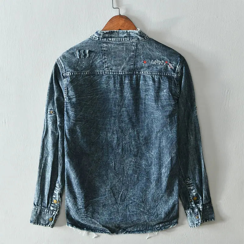 Distressed light blue men's collarless button-down shirt, a casual and edgy top for unique style.