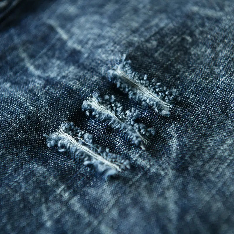 Light blue collarless men's button-down shirt featuring an edgy, distressed look. Unique and fashionable.