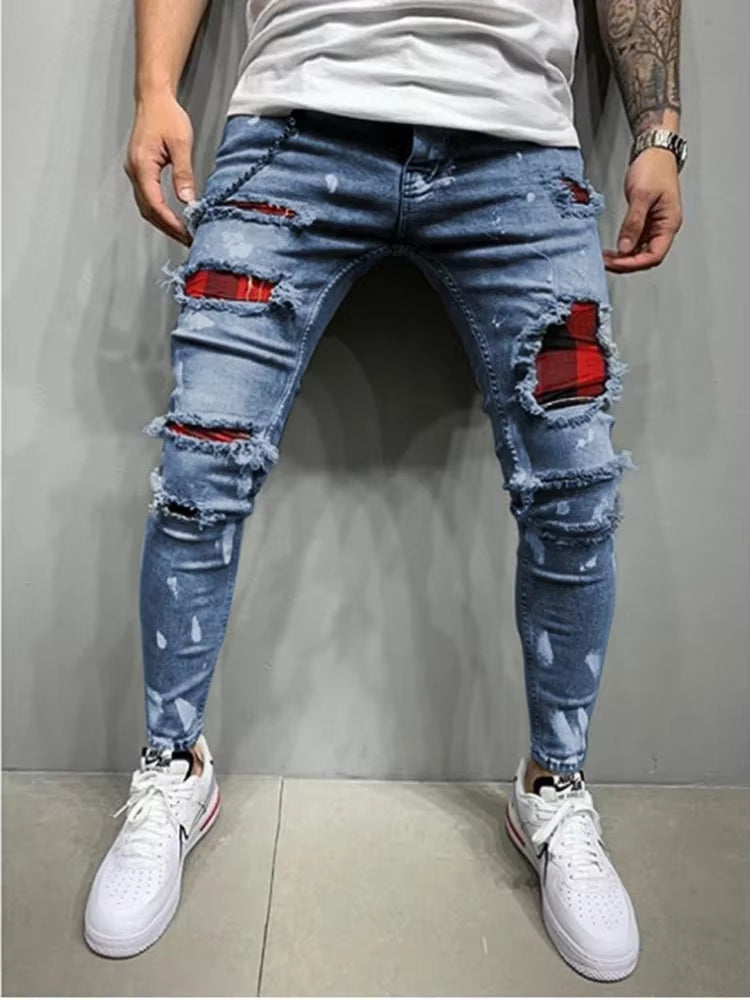 Unique men's distressed denim pants with an edgy design, stretch comfort, and a fashionable tapered cut.