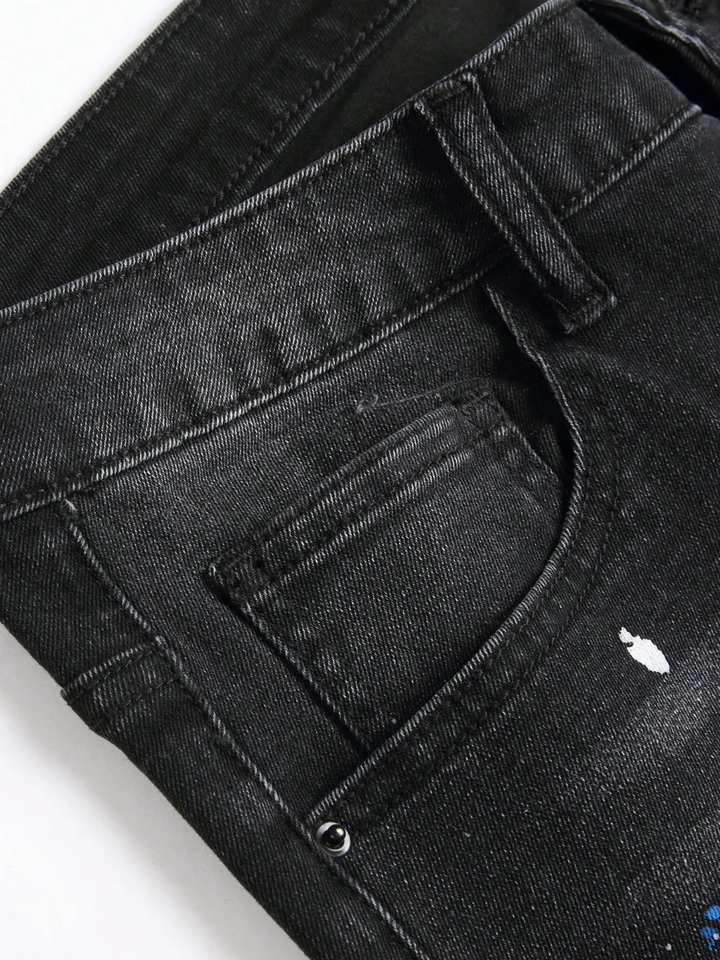 Comfortable stretch distressed denim jeans for men, featuring a trendy tapered fit and edgy streetwear style.