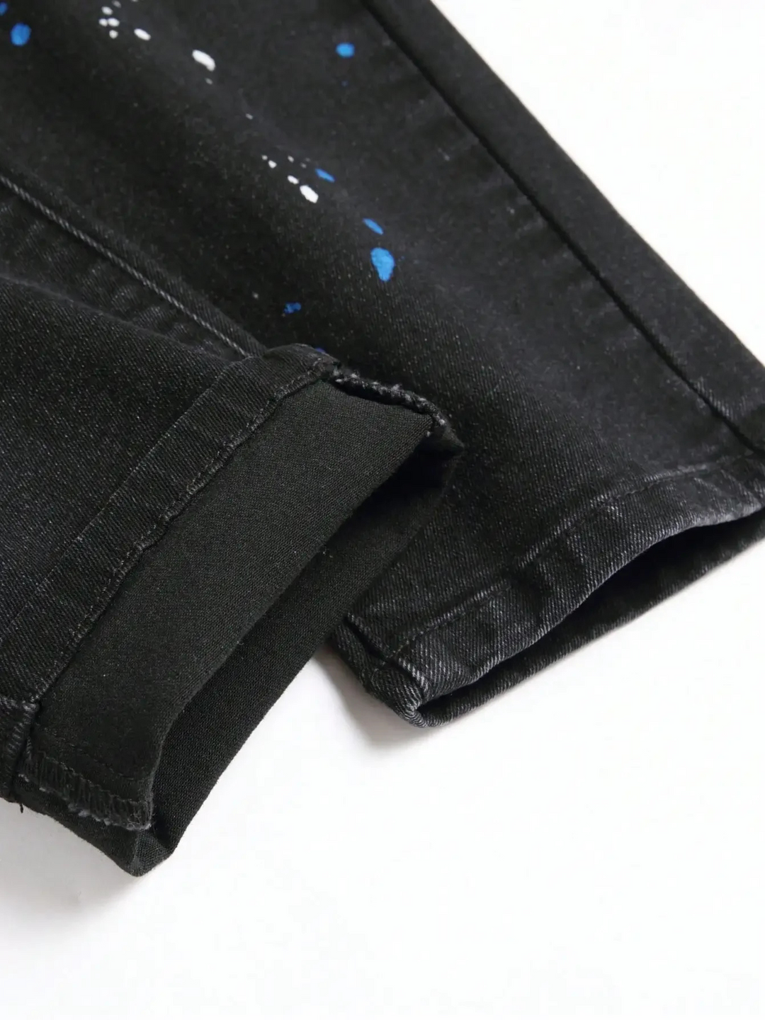 Men's edgy distressed denim pants, offering a unique style with a tapered fit, ideal for casual streetwear.