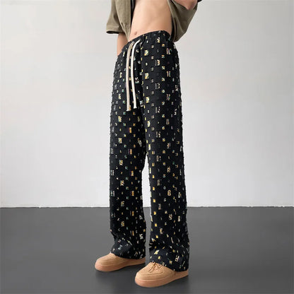 Bold men's fashion pants with distressed rips and custom patchwork, ideal for an edgy urban look.