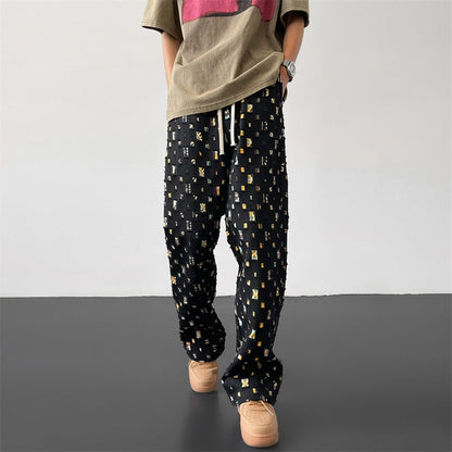 Men's unique ripped and patchwork pants, offering a stand-out distressed design for modern streetwear.