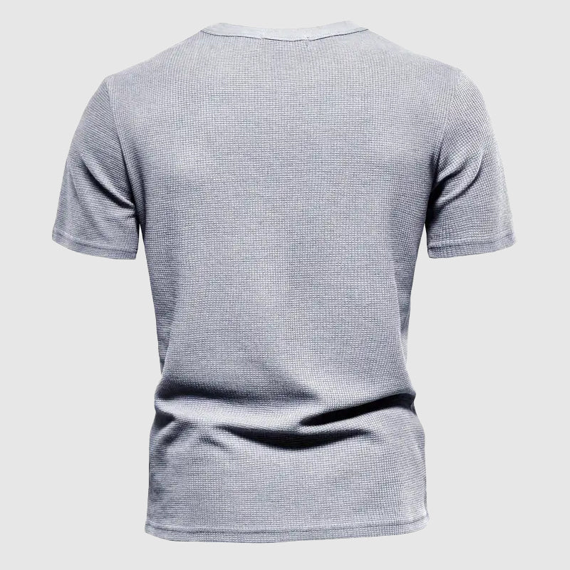 Refined men's casual tee, providing breathable comfort for stylish summer fashion and daily essentials.