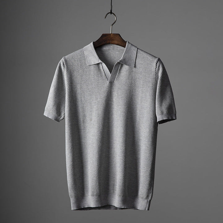Dark blue men's smart casual knit polo shirt, ideal for everyday style.