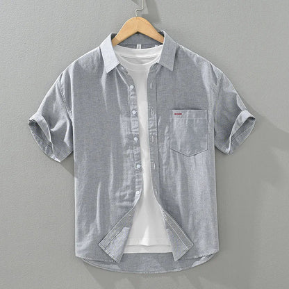 Men's relaxed fit short sleeve shirt, button-up design, perfect lightweight choice for summer wear.
