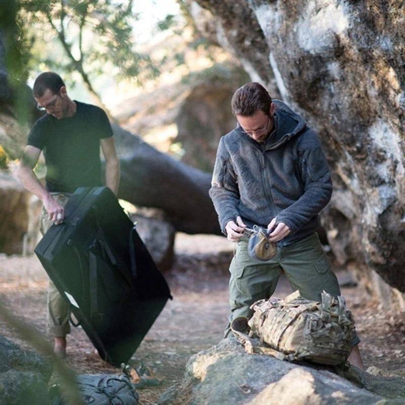 Close-up of camouflage print on men's cargo pants, polyester cotton blend