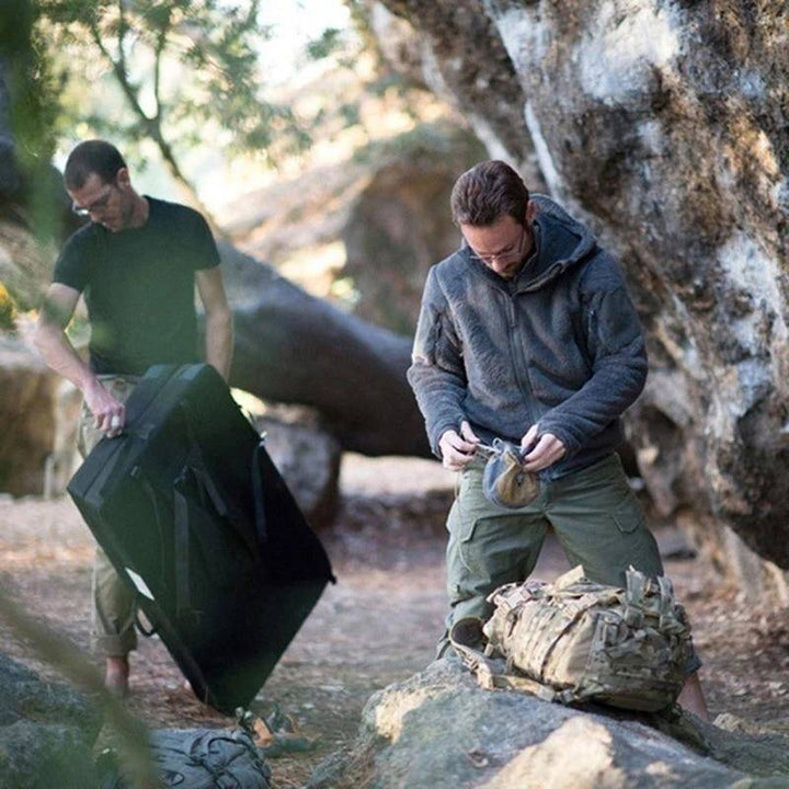 Close-up of camouflage print on men's cargo pants, polyester cotton blend