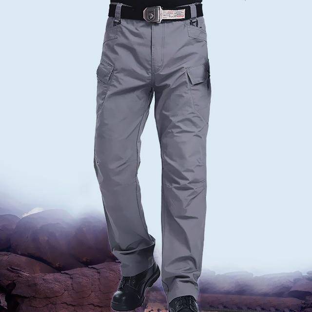 Folded men's camouflage cargo pants, ready for adventure, durable fabric