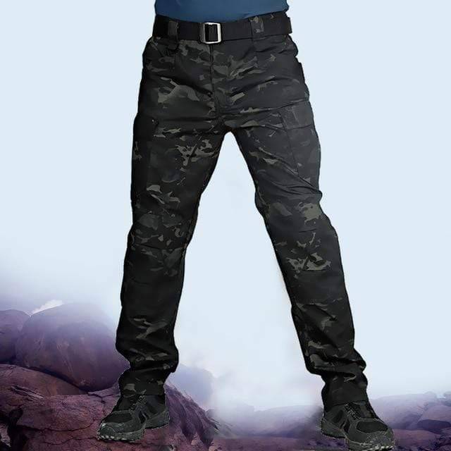 Detail of elastic waistband and drawstring on men's camouflage cargo pants