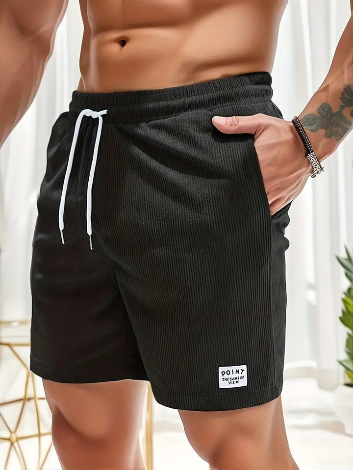 Durable men's quick-dry swimwear, elastic waist for comfort on vacation or at the pool.