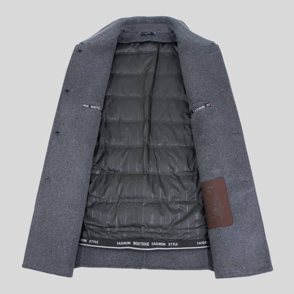 Elegant men's winter overcoat. A classic black trench coat with a tailored fit, perfect for sophisticated outerwear.