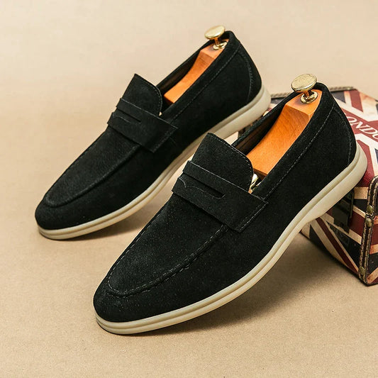 Men's elegant black slip-on loafers for refined style, perfect for dress or casual wear.