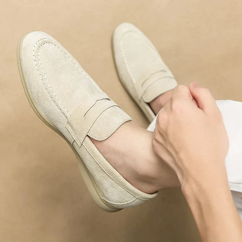Beige men's elegant slip-on loafers, perfect footwear for refined dress or casual wear.