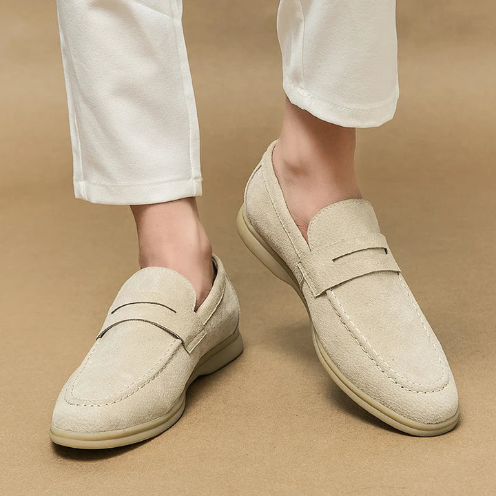 Classic men's black slip-on loafers, versatile for elegant dress & casual fashion.
