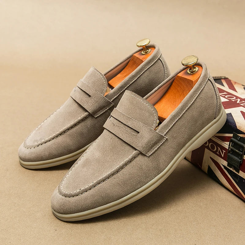 Elegant men's slip-on loafers, versatile black footwear for both dress and casual men's fashion.