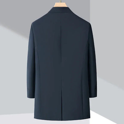Sleek men's long winter trench coat, insulated outerwear, ideal for elegant cold weather fashion.