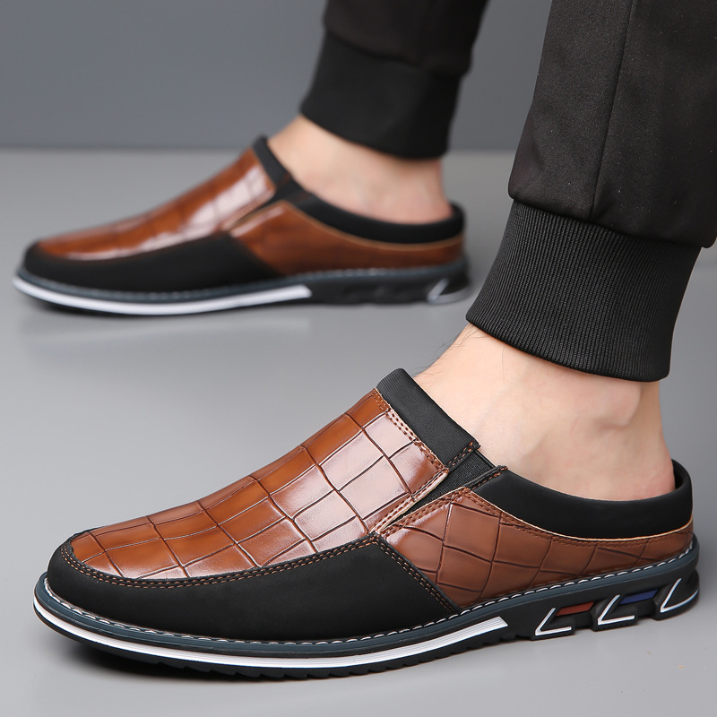 Top view of elegant men's embossed slip-on mules; easy wear, stylish design.