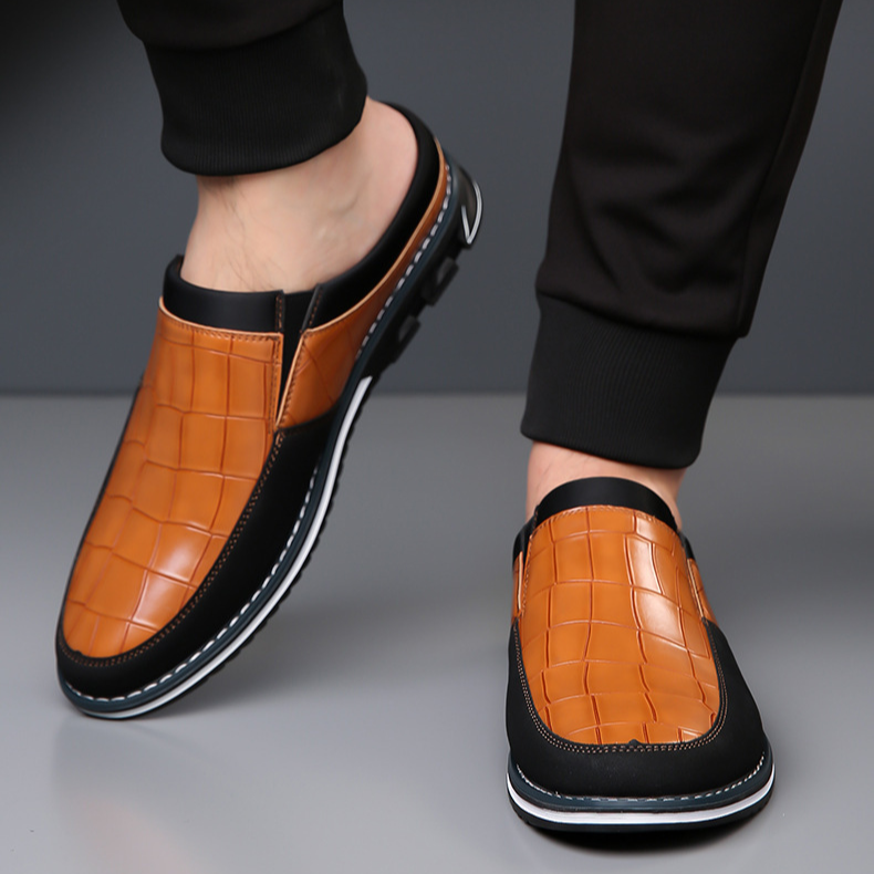 Cushioned insole clearly visible inside men's stylish embossed slip-on mules.