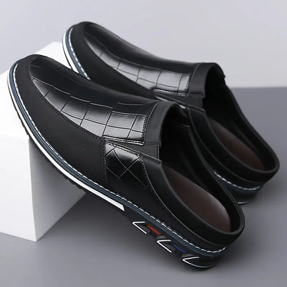 Classic men's slip-on mules with unique embossed design & cushioned insole.