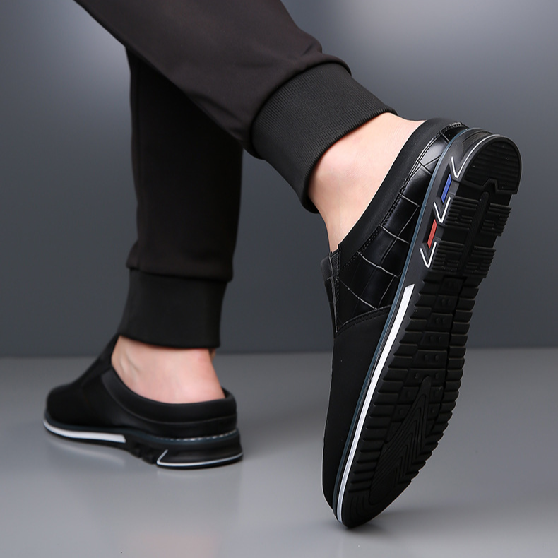 Stylish men's loafers: embossed slip-on mules with a durable grip sole.