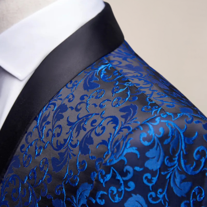 Stylish man wearing a black embroidered slim fit tuxedo blazer, complete with elegant wedding attire.