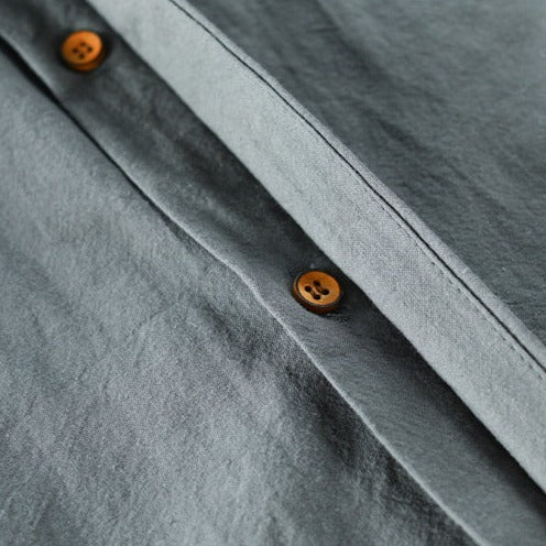 Men's button-down katana style shirt with unique Japanese inspired details. Elegant cultural wear for modern traditional men.
