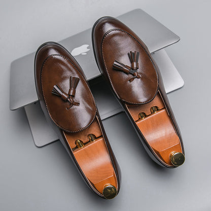 Men's elegant polished tassel loafers, perfect for formal or smart casual outfits, offering classic comfort.