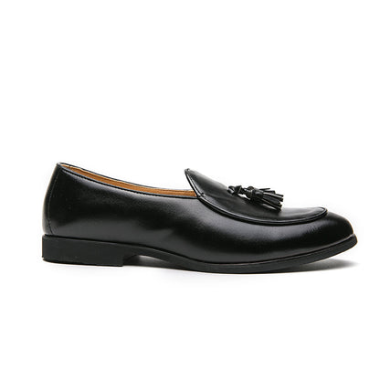 Glossy polished men's tassel loafers, elegant slip-on shoes providing comfort for classic formal & casual looks.