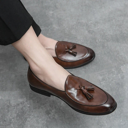 Shiny polished leather men's tassel loafers, an elegant and comfortable slip-on shoe for classic men's fashion.