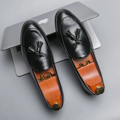 Elegant men's slip-on tassel loafers, polished finish adds a refined touch to formal & casual men's outfits.