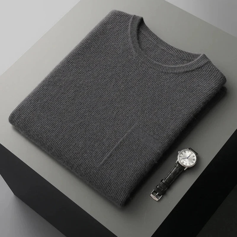 Textured men's premium sleeveless sweater vest. Elegant knitwear top for layering, offering a comfortable, sleek fit.