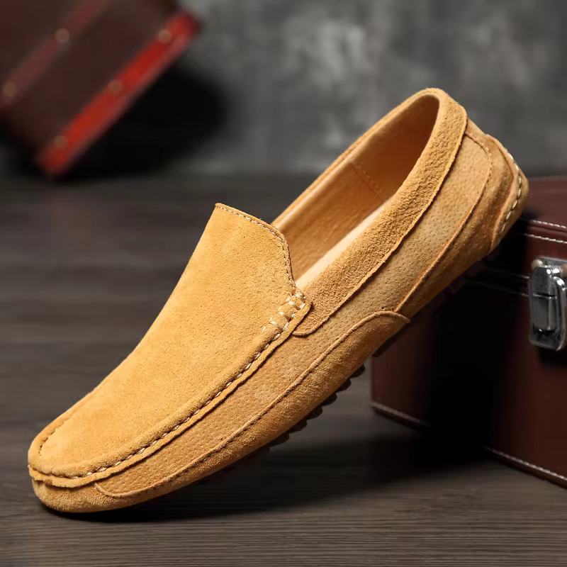 Side view of elegant men's slip-on loafers. Modern design meets classic comfort in versatile footwear.